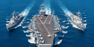 Indo-Pacific Strategy 2026: US Alliances & Regional Stability U.S. Navy aircraft carrier leading allied fleet in Indo-Pacific waters, symbolizing strategic cooperation.